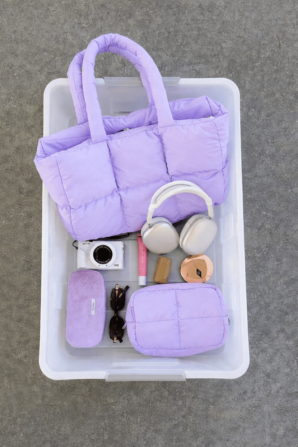Purple puffer duffle tote with handle, holds small accessories
