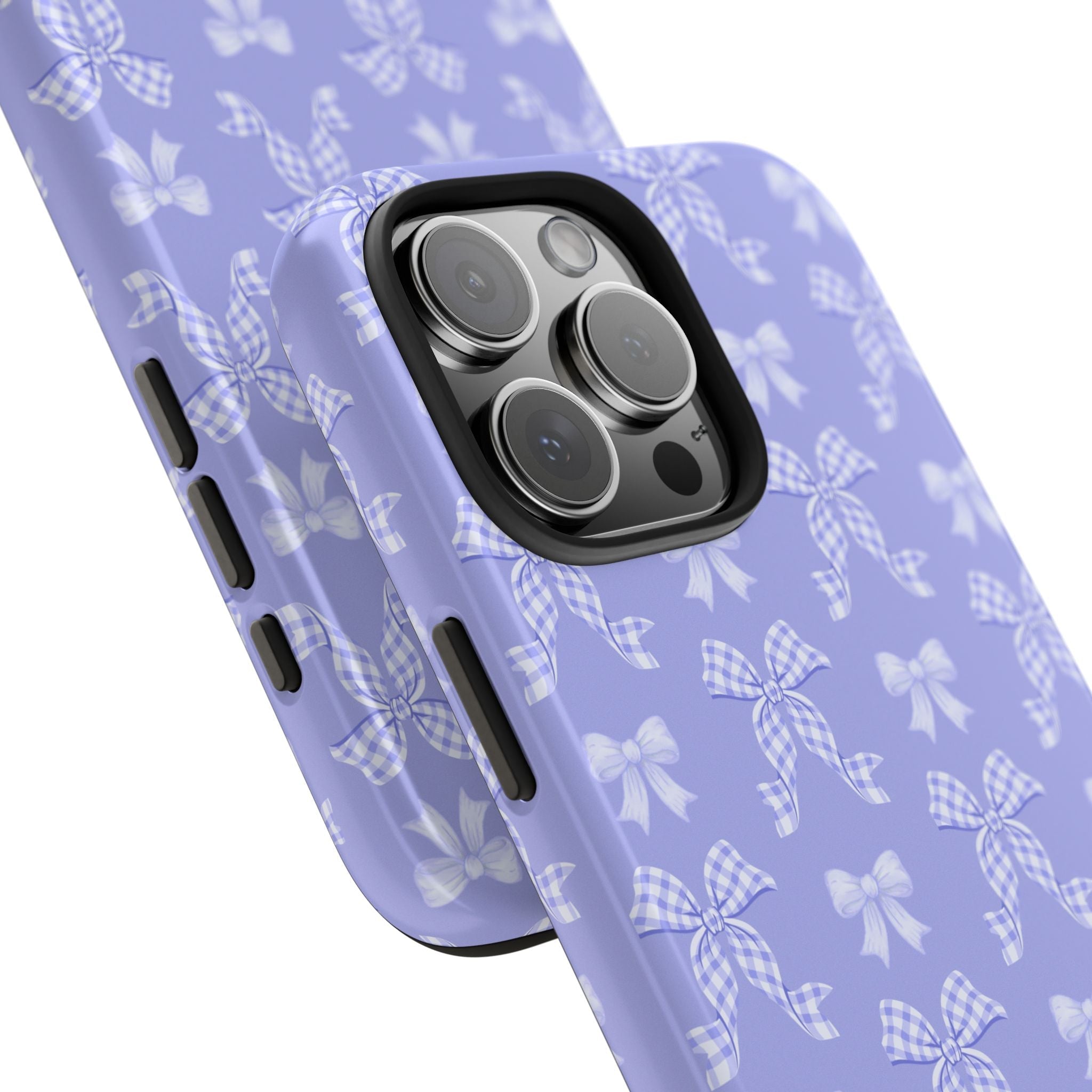 Diagonal view of purple phone case with bow pattern and camera lens cutouts