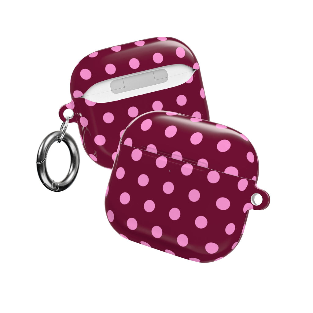 Maroon AirPods case with pink polka dots, includes metal keyring and loop