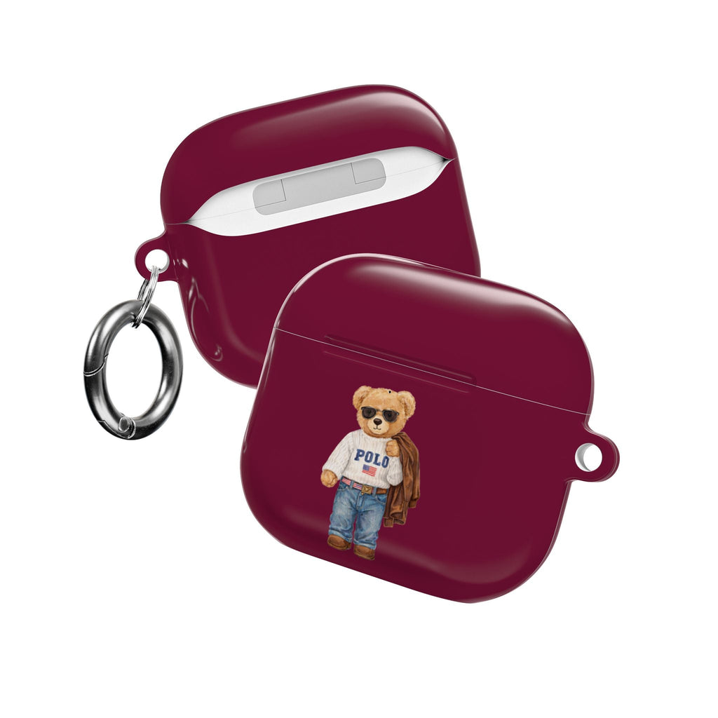 Maroon AirPods case with teddy bear Polo graphic, earbud slot area, metal keyring