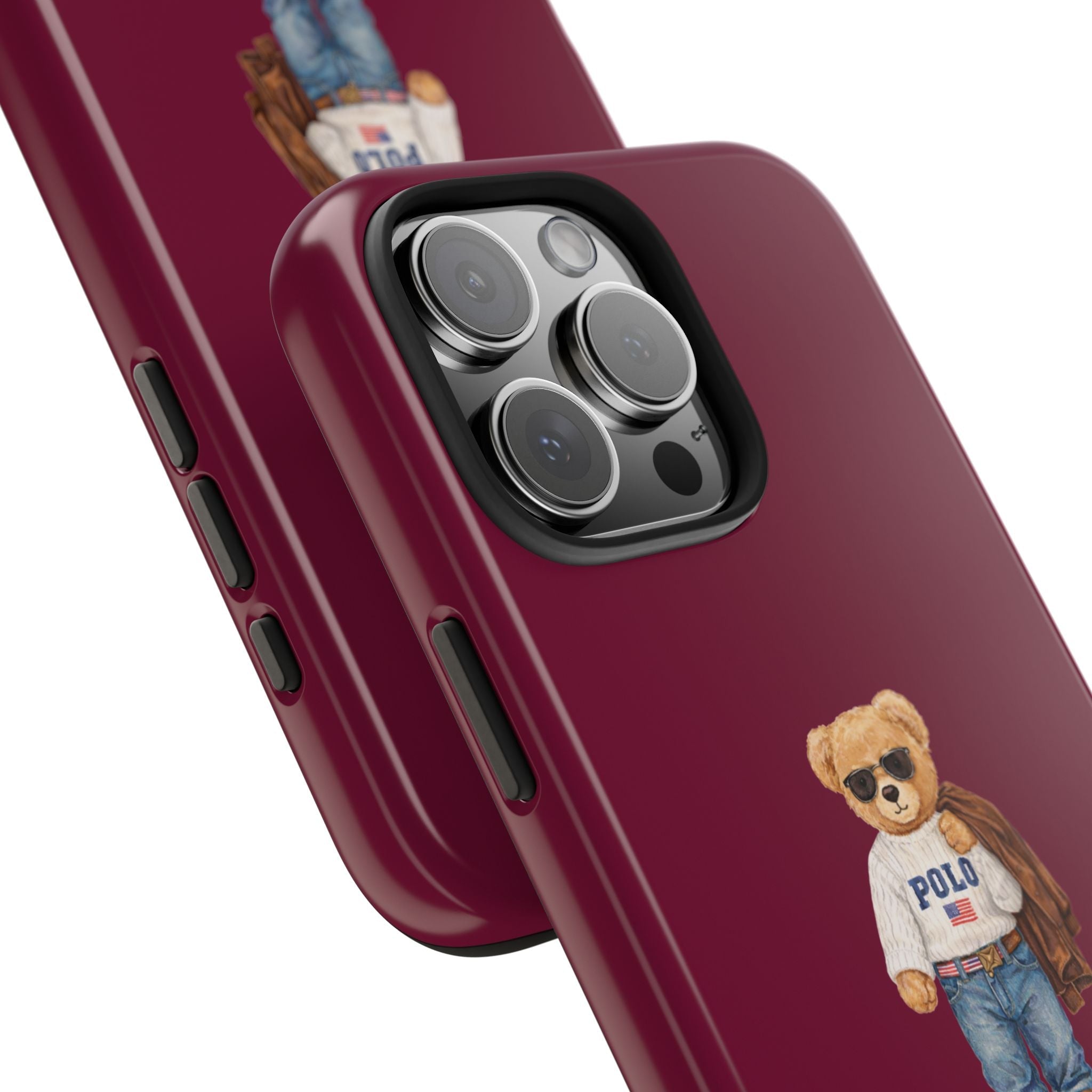Burgundy phone case detail: bear graphic near camera cutout and side buttons