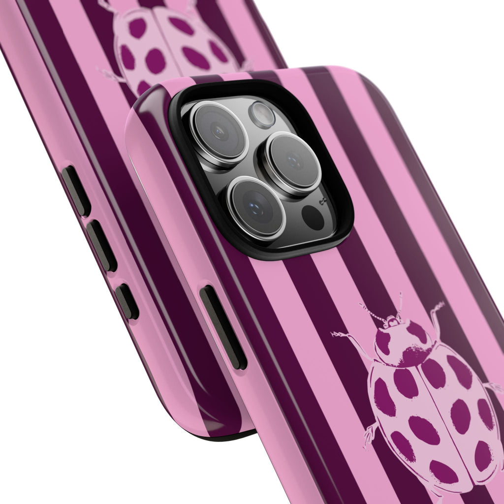 Side view of raspberry striped phone case with ladybug graphic and camera lens cutouts