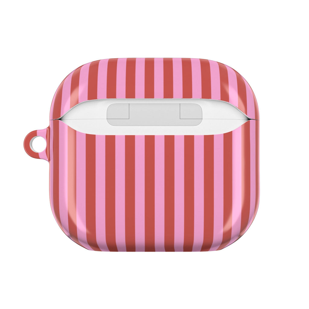 Closed AirPod case with red/pink vertical candy-cane stripes and charging cutout.