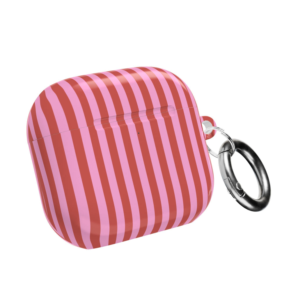 Candy-cane striped AirPod case with metal keyring attached.