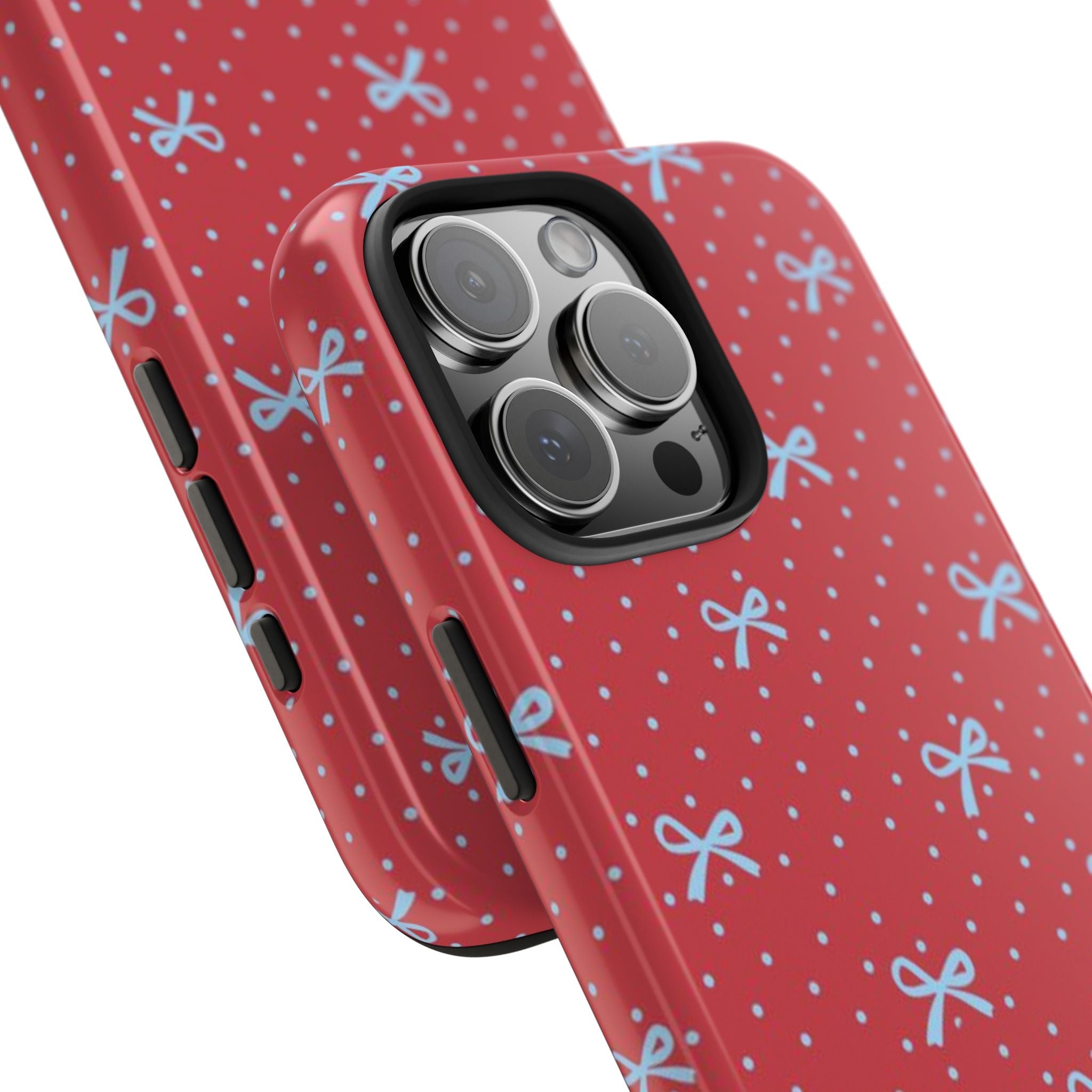 Angled red polka-dot phone case with blue bows and camera lens cutouts
