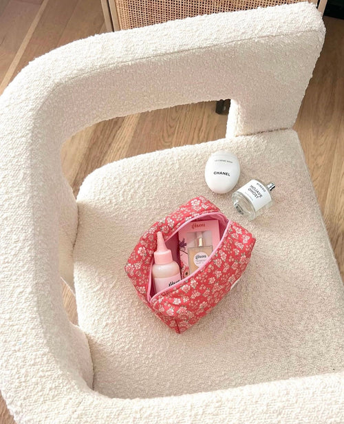 Red floral pouch inside cream textured organizer with top opening