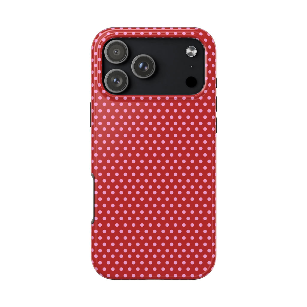 Red and pink polka dot phone case with camera cutout and raised edges