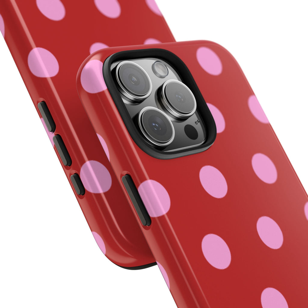 Red polka dot phone case with pink dots, button openings and camera lens cover