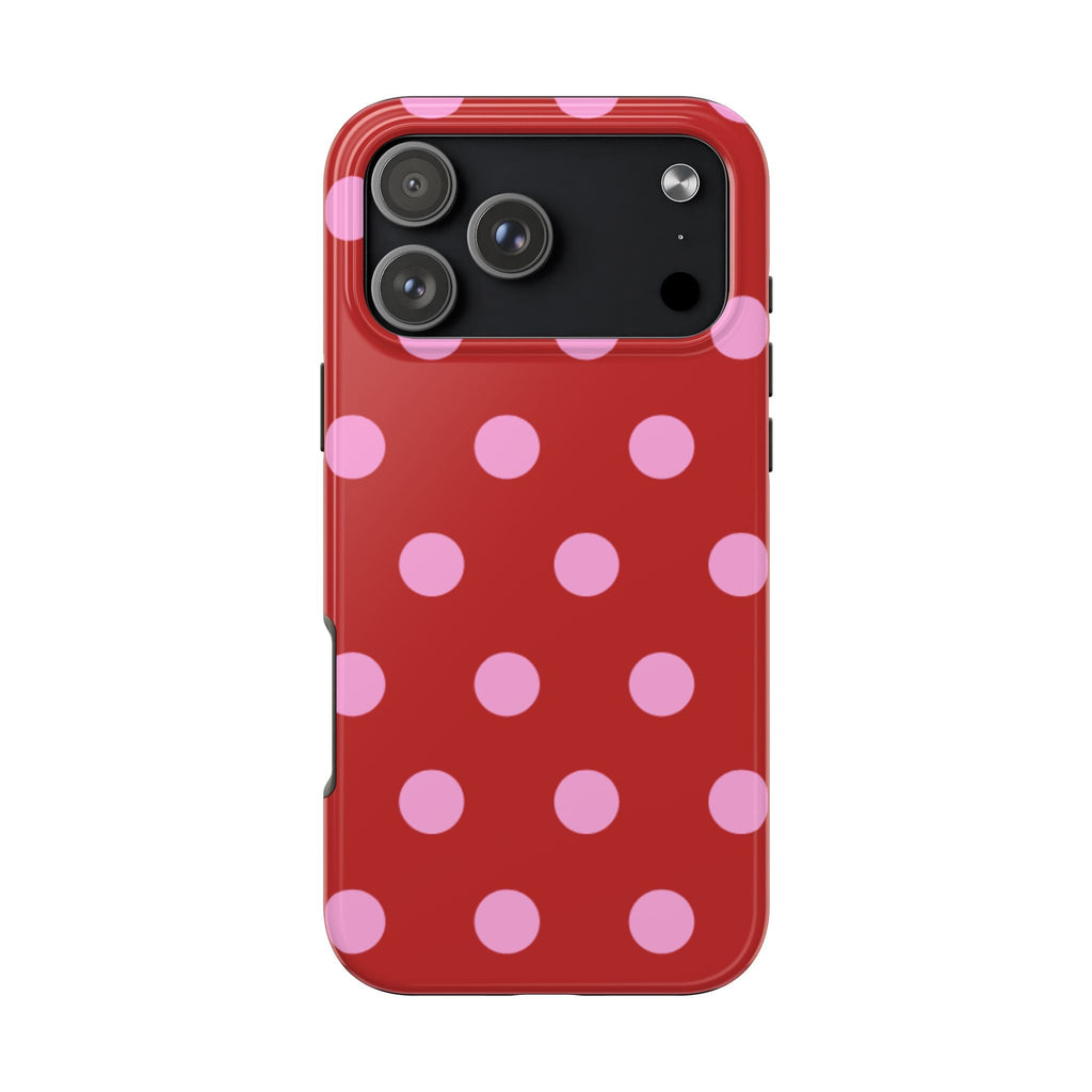 Red phone case with pink polka dots and camera cutout openings
