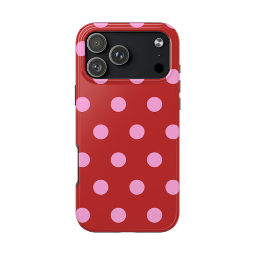 Red phone case with pink polka dots and camera cutout openings