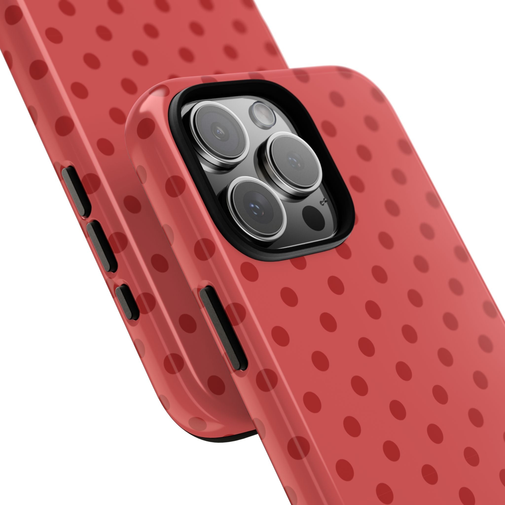Red polka dot phone case, angled view with camera lenses and side buttons