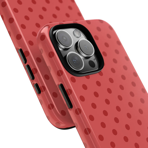 Red polka dot phone case, angled view with camera lenses and side buttons