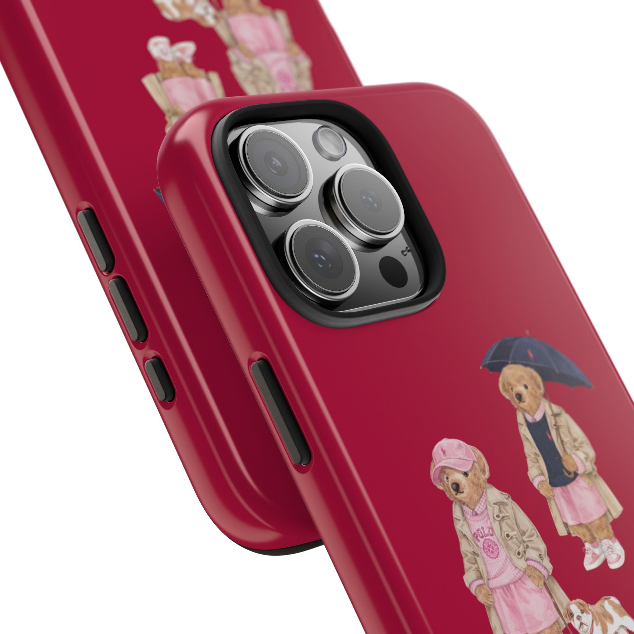 Red teddy bear phone case with umbrella characters, shown in angled view near camera