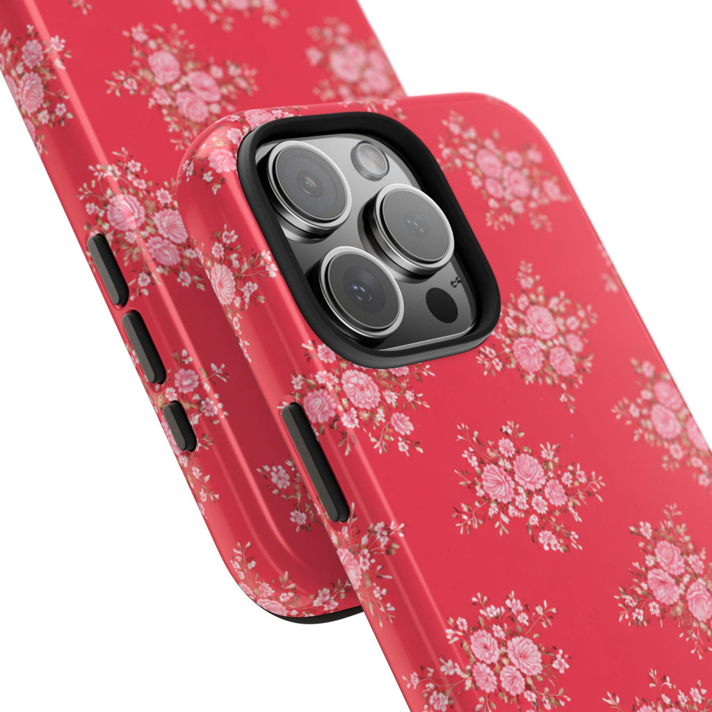Red floral phone case angled view showing side buttons and camera lens area