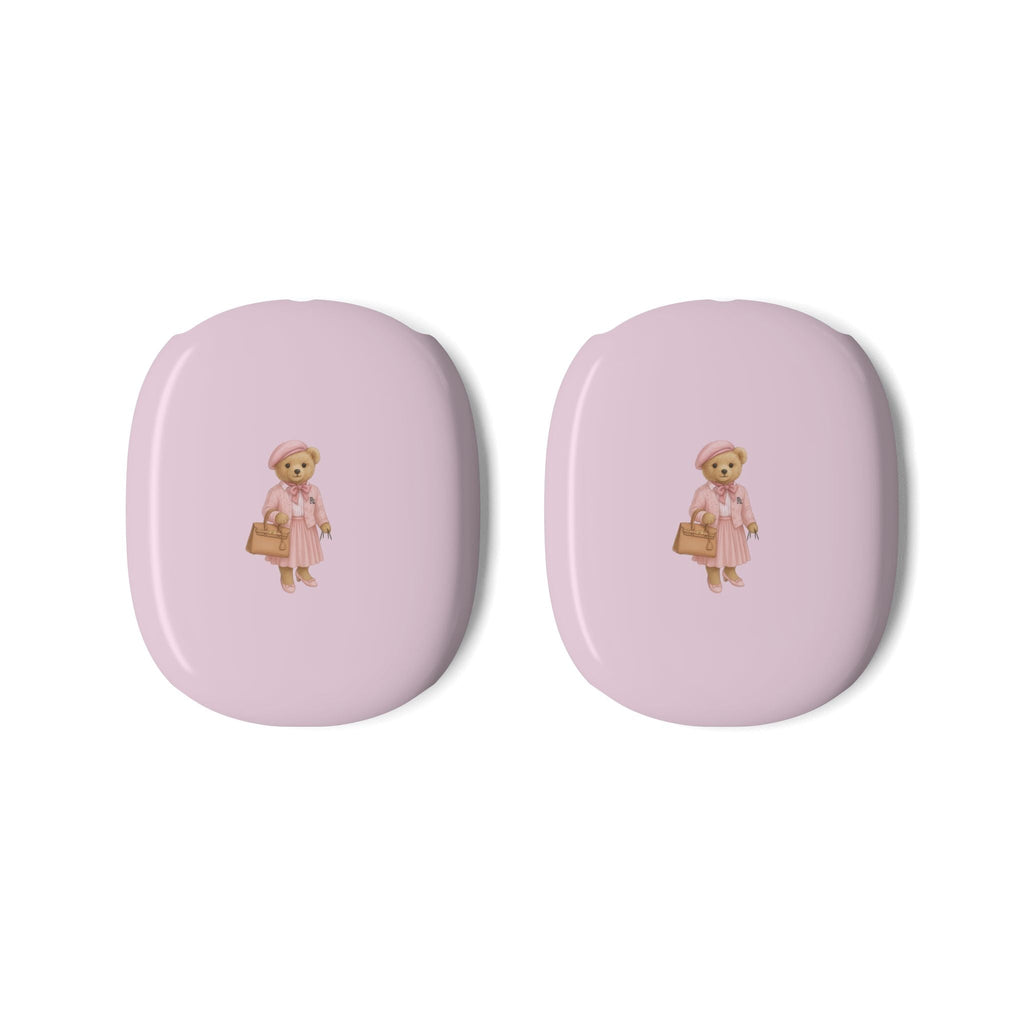 Two pink ear cup covers featuring teddy bear girl graphic on glossy surfaces.