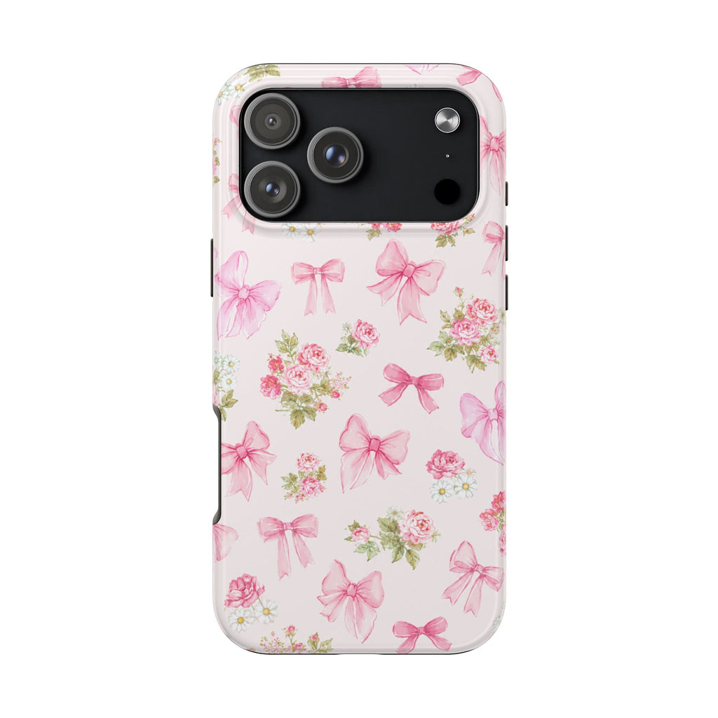 Pink floral bow phone case with clear edges, shows triple camera cutouts