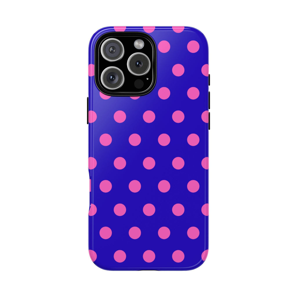 Royal blue phone case with pink polka dots; camera cutout visible on the back
