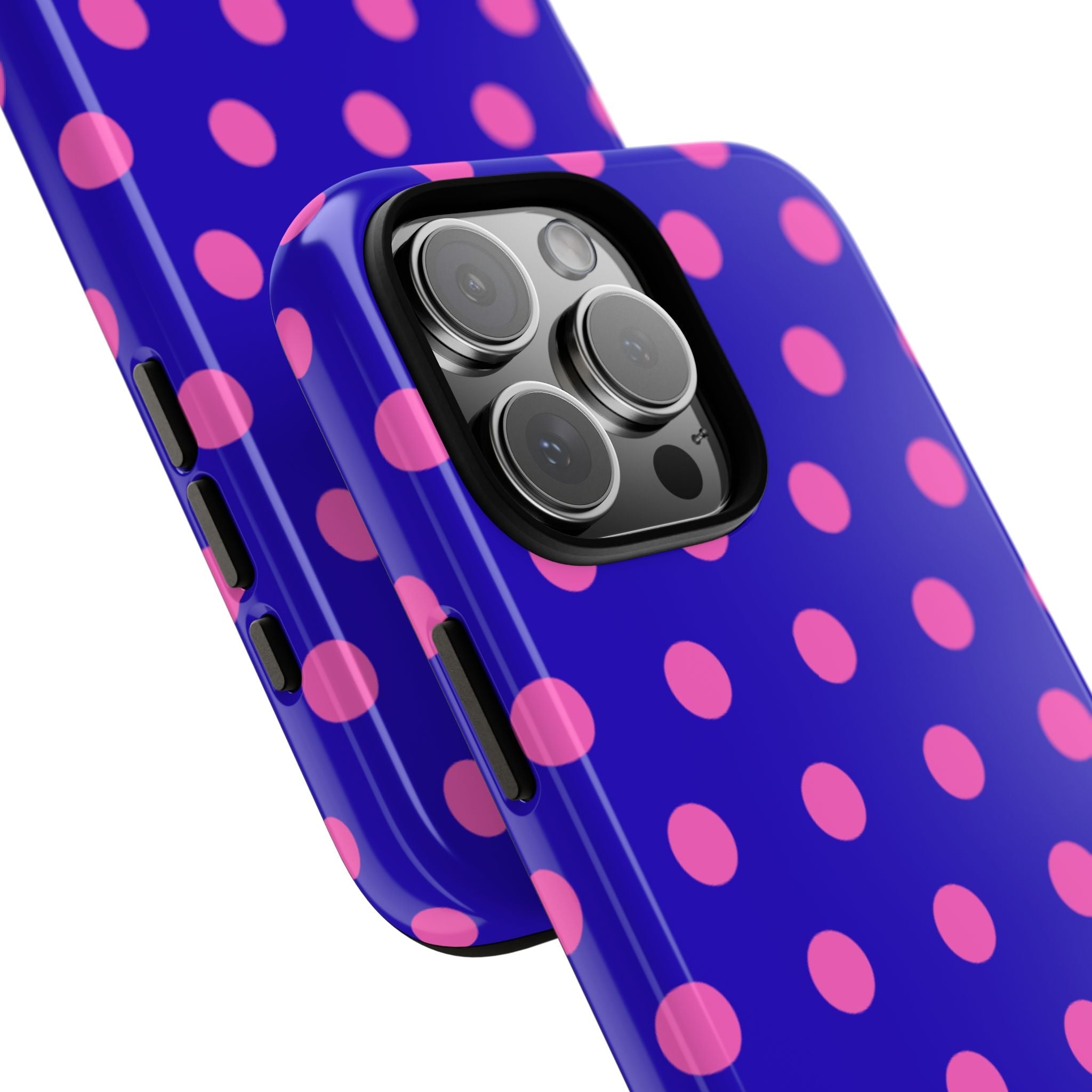 Angled phone case showing side buttons and camera lenses over pink polka dots