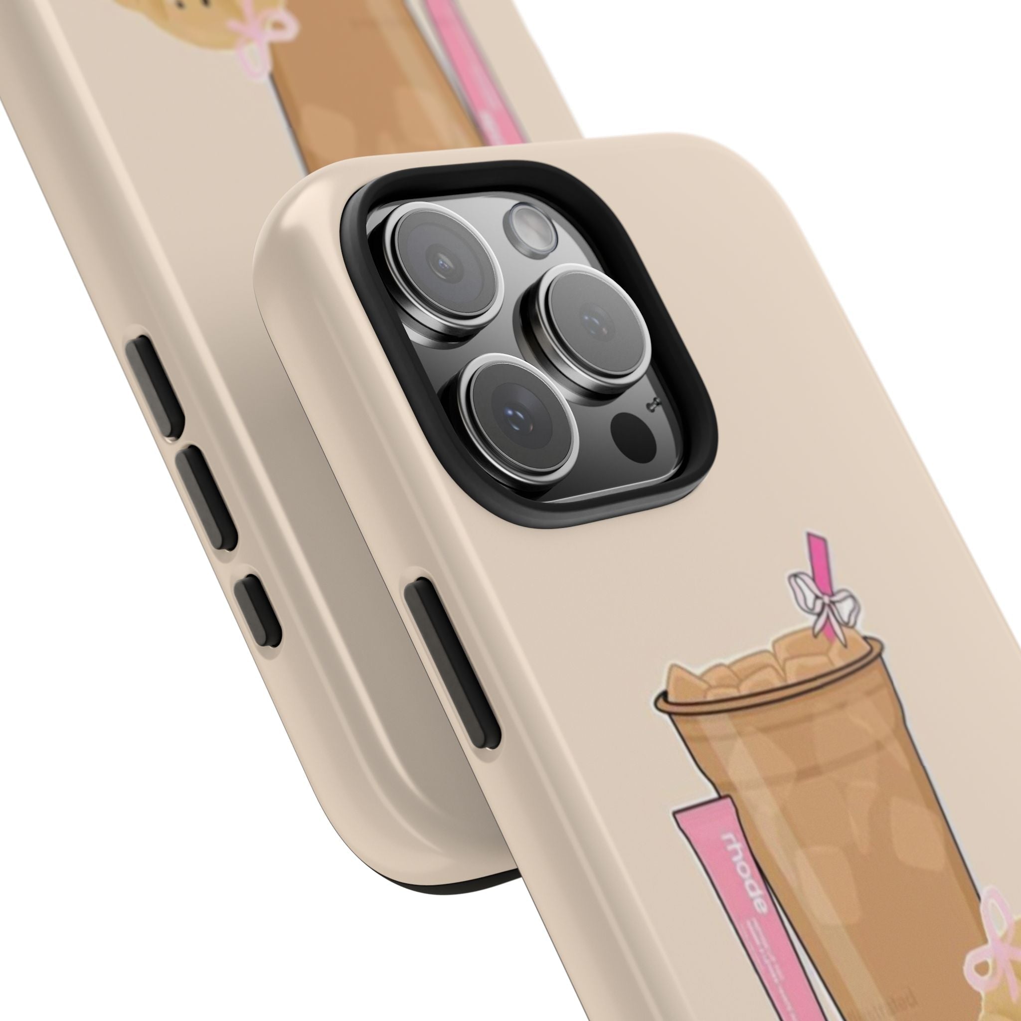 Close-up beige phone case corner: camera lenses ringed, side buttons, drink graphic.