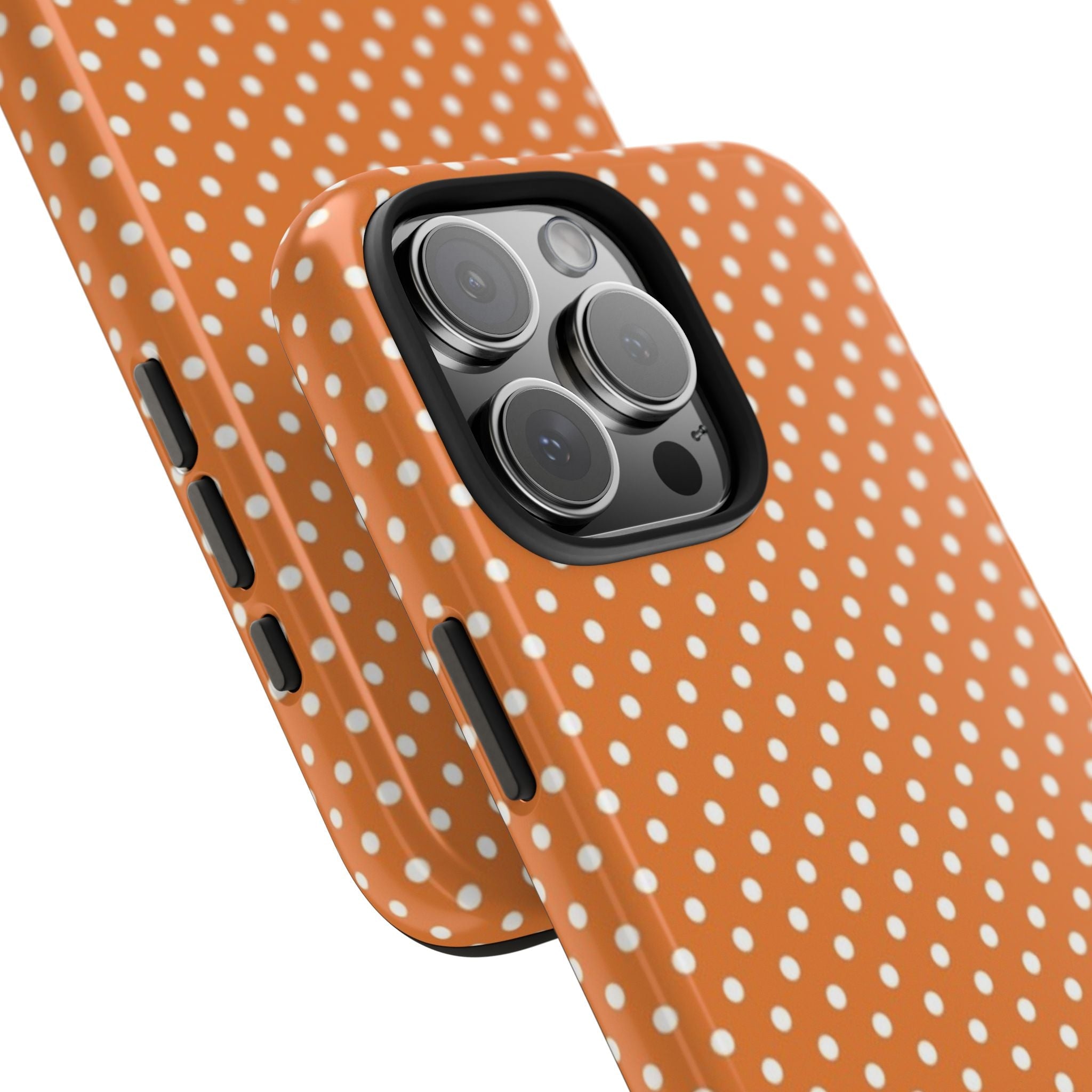 Orange polka dot phone case showing raised camera cover and side button cutouts
