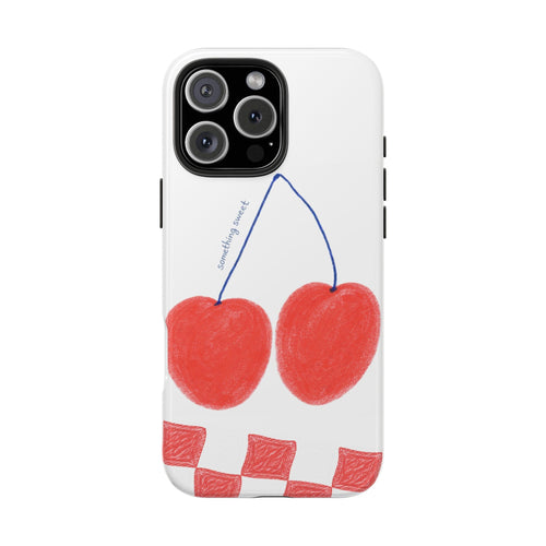 White phone case with red cherries, blue line accents, and red checker pattern