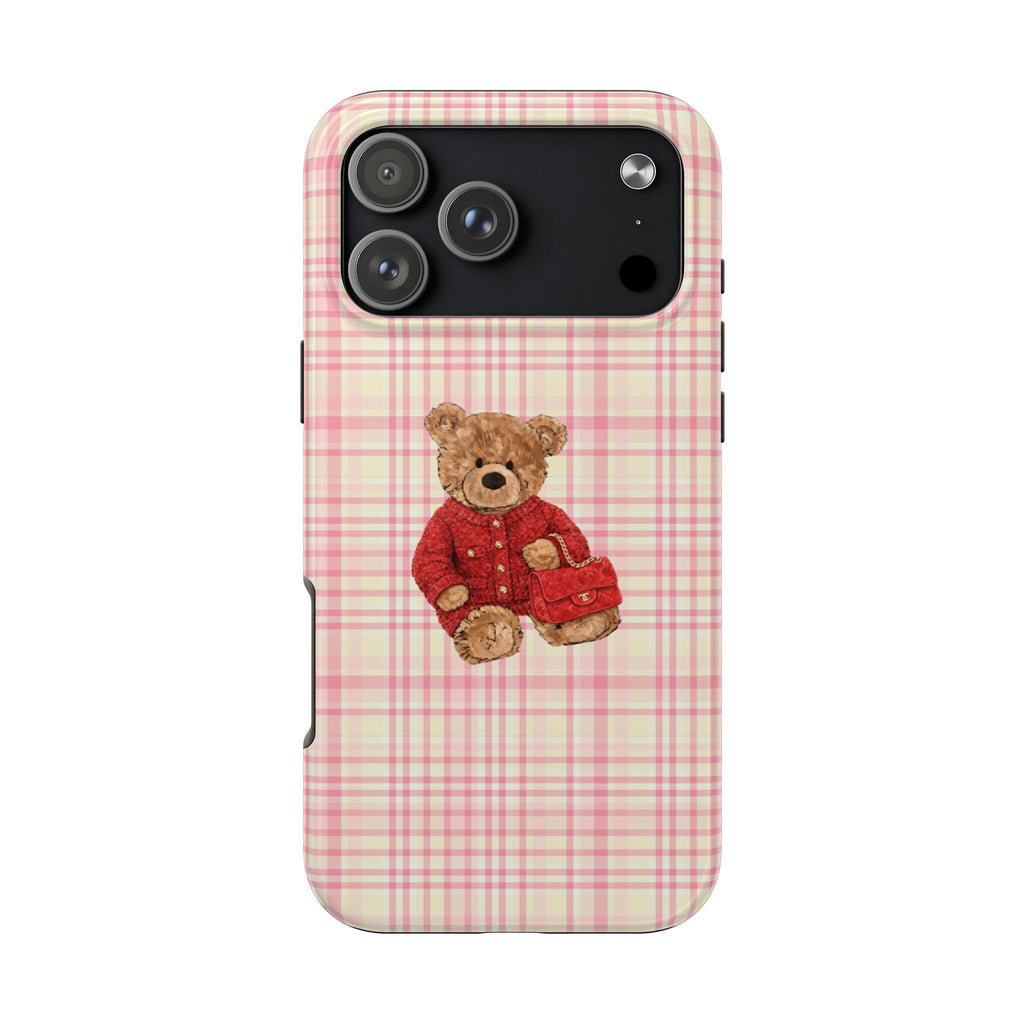 Plaid phone case with tan teddy bear in red outfit and camera cutout at top