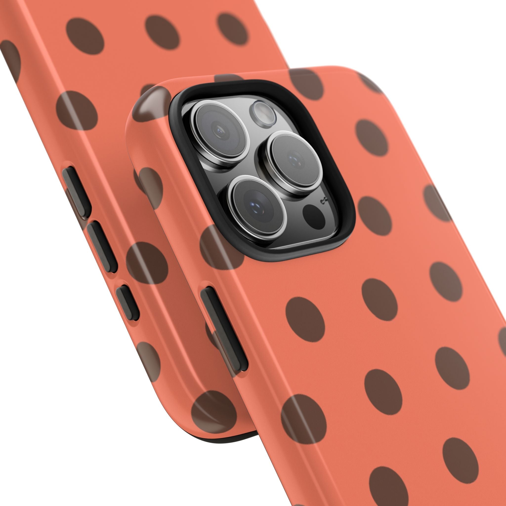 Orange polka dot phone case corner view; camera lenses in black frame