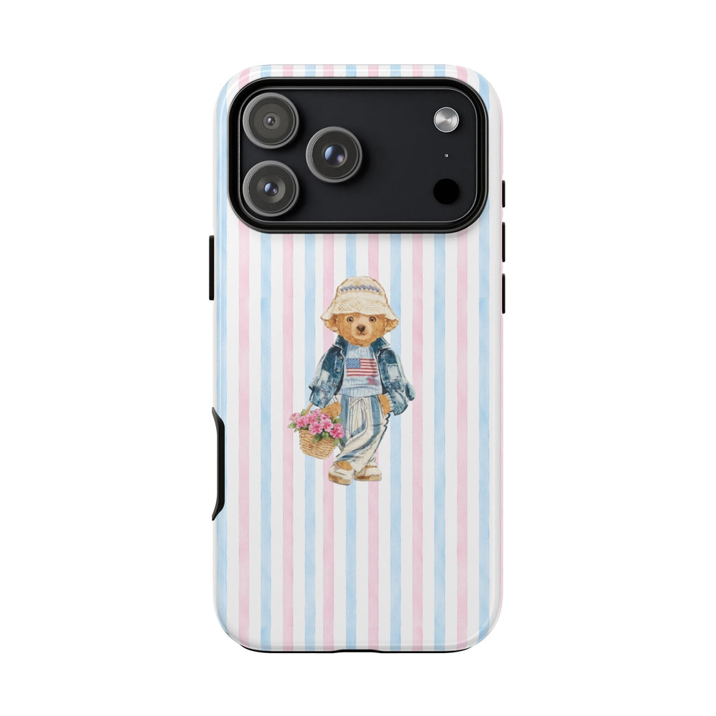 Pink and blue vertical stripe phone case with teddy bear wearing hat and overalls