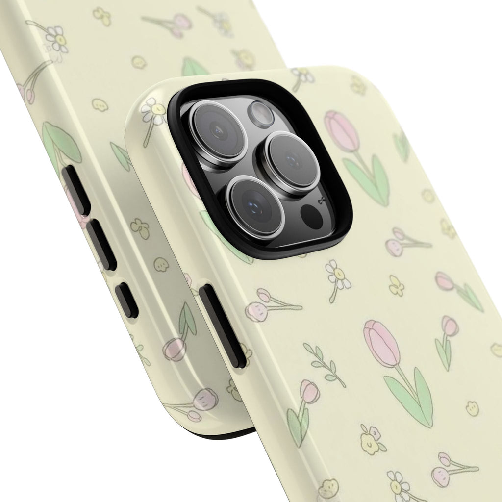 Angled cream spring tulip phone case with pink flowers and green leaves; side buttons
