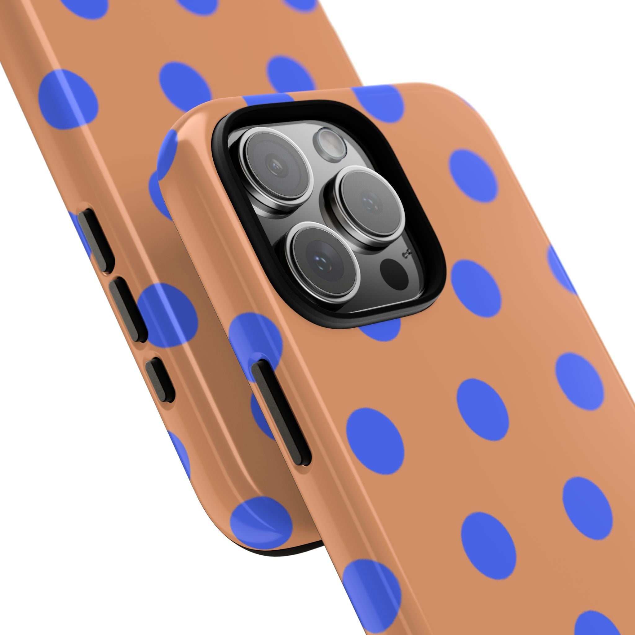 Tan polka dot phone case with blue dots; angled view shows camera lenses and cutouts.