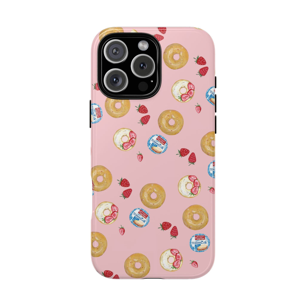 Pink phone case with strawberry & bagel pattern, camera cutout