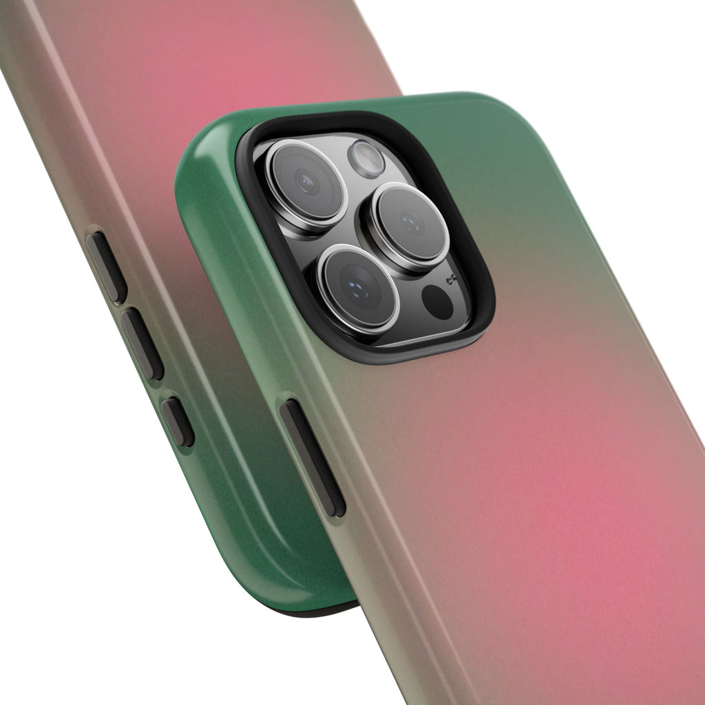 Close-up phone case showing green edge, pink gradient, and triple-lens camera cover