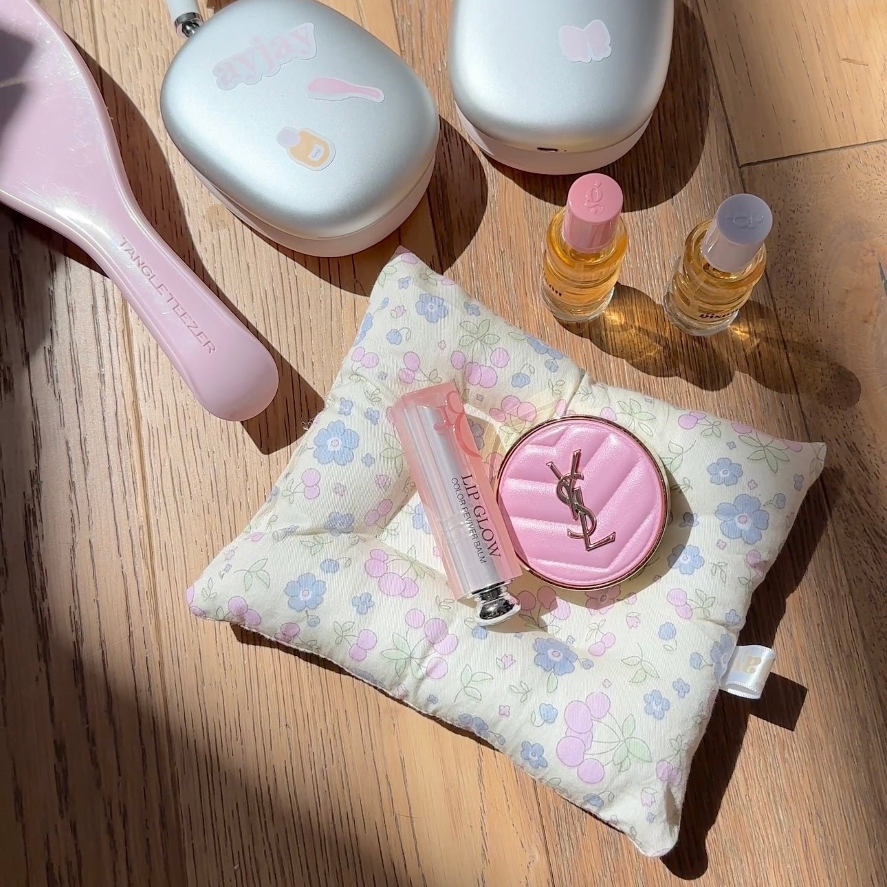 Summer floral cloud coaster in pastel blue and pink with pink circular logo detail
