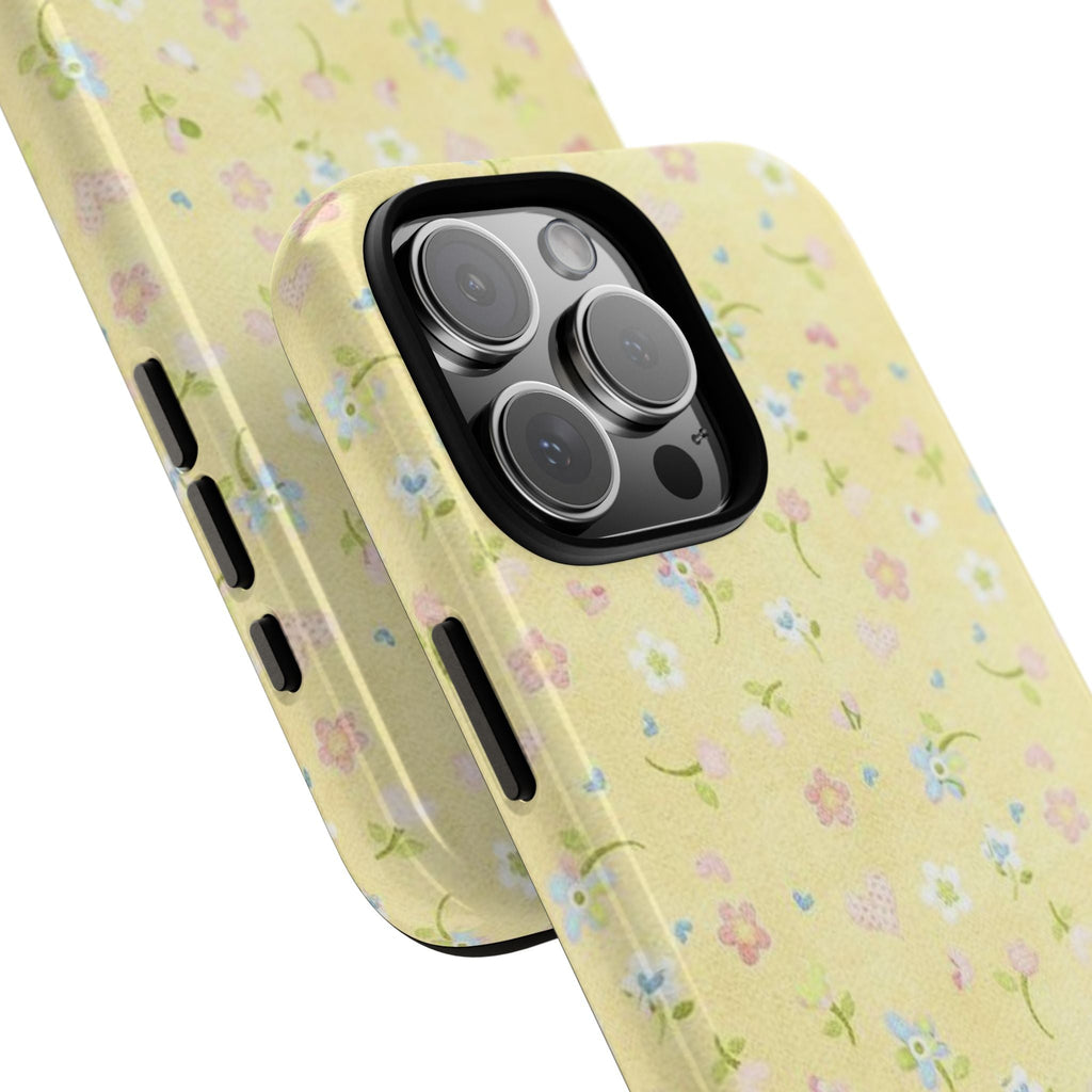 Yellow floral phone case angled view, side buttons and camera lenses visible