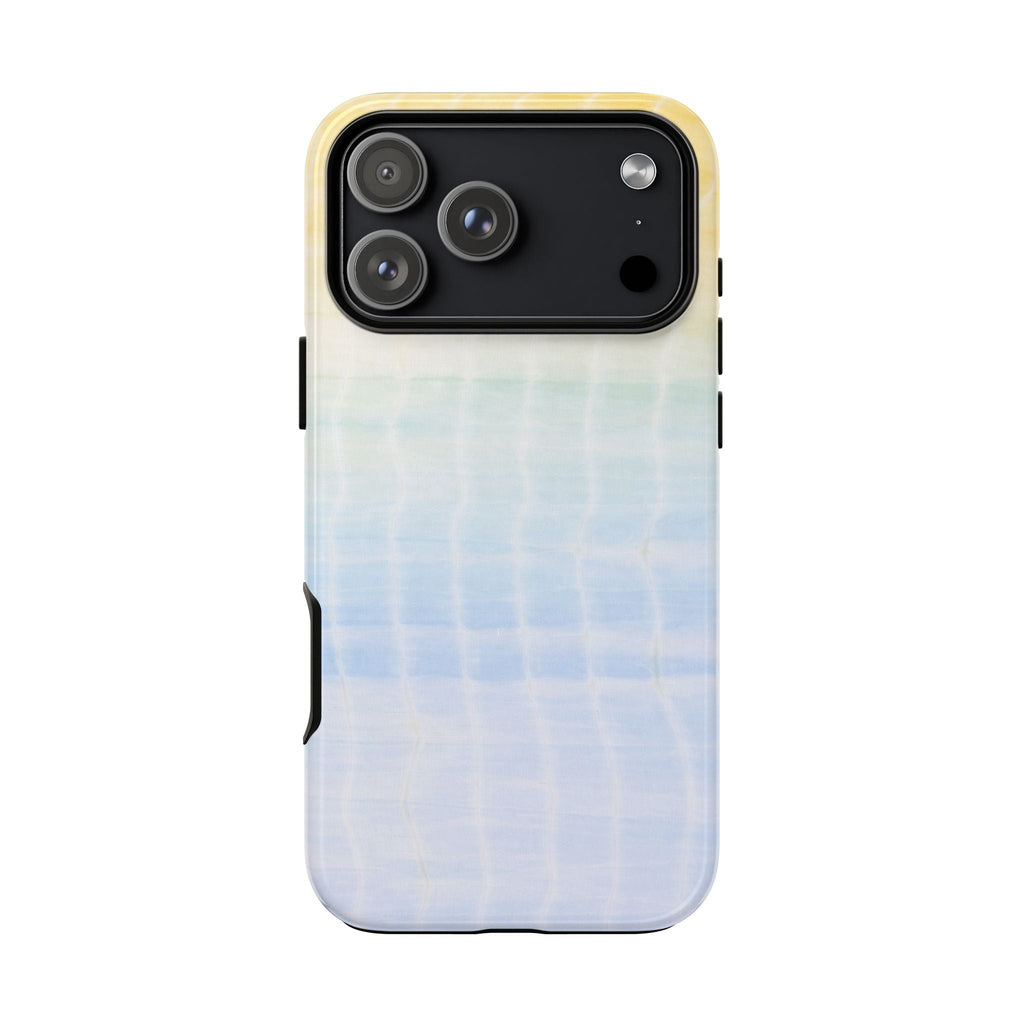 Sunshine shibori tie-dye phone case in light blue with yellow trim, camera openings visible