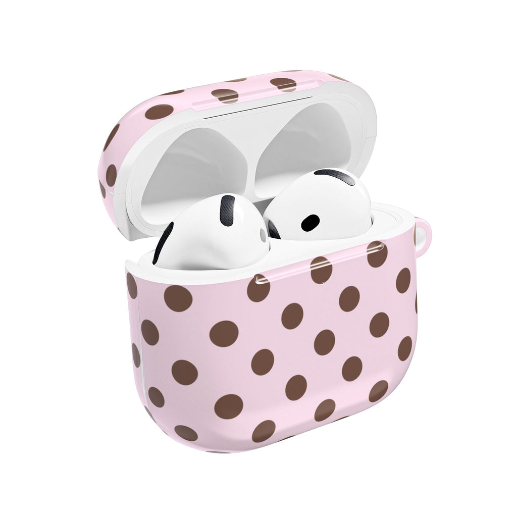 Pink polka dot AirPods case with earbuds inside, open lid