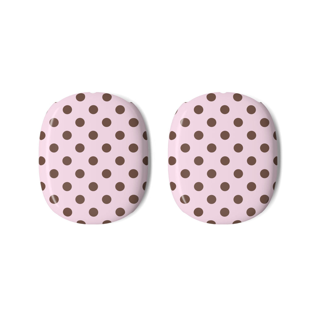 Two AirPods Max case covers, pink base with dark brown polka dot pattern