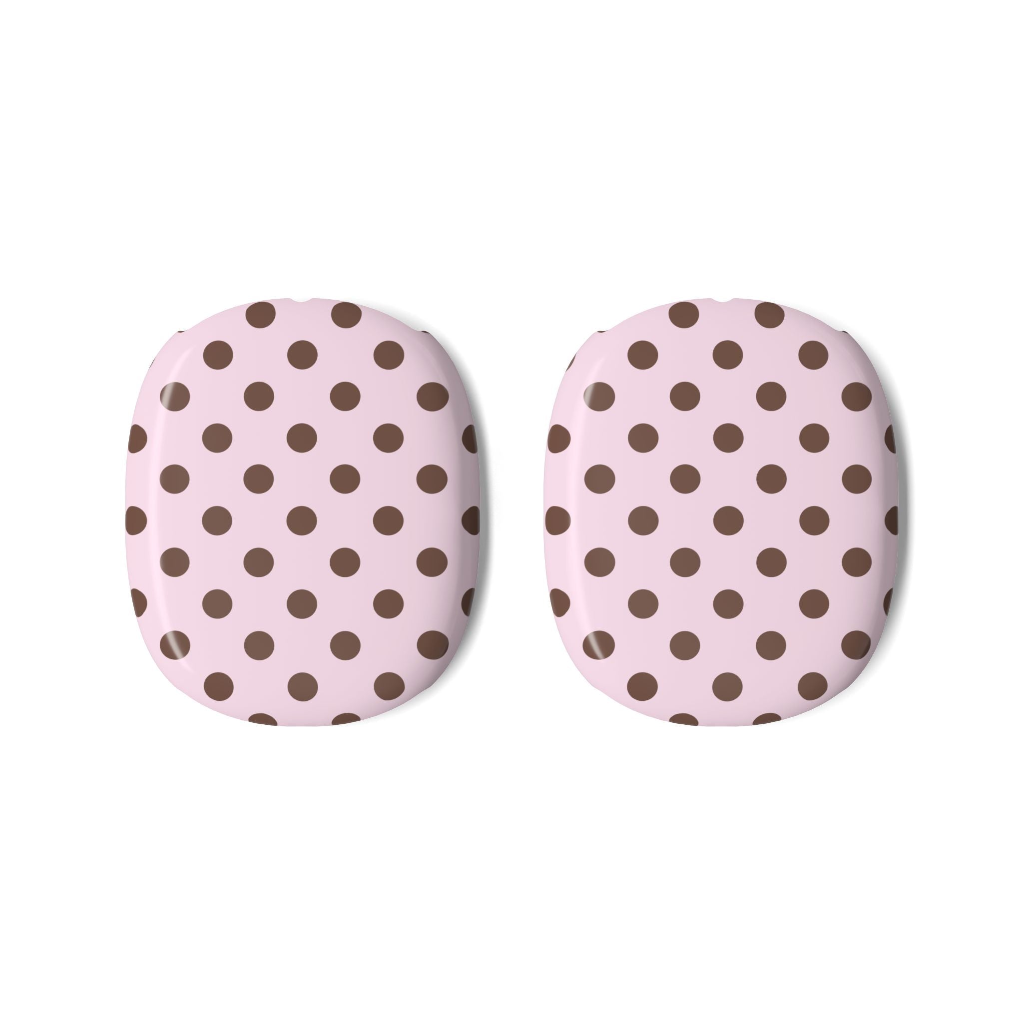 Two AirPods Max case covers, pink base with dark brown polka dot pattern
