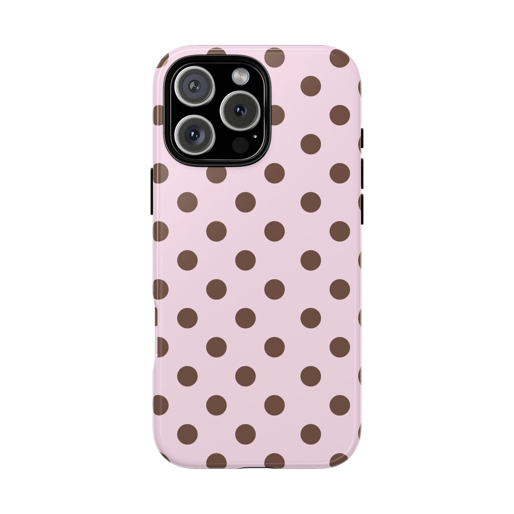 Pink phone case with brown polka dots and raised camera ring cutouts