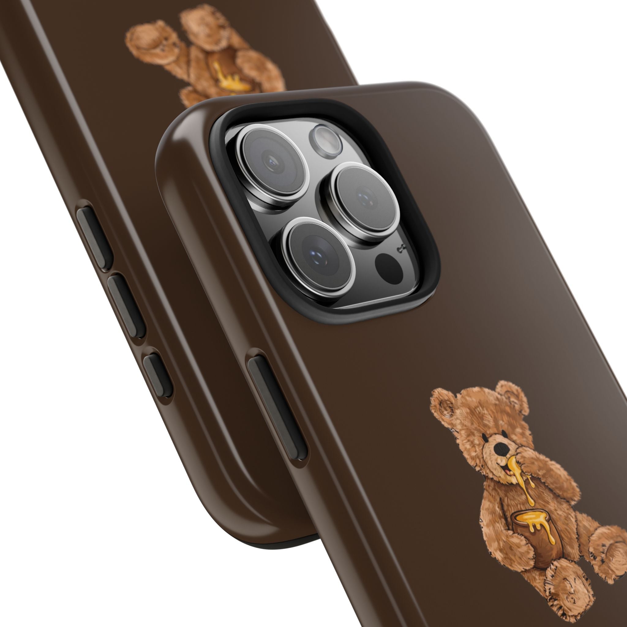 Brown phone case side view with teddy bear graphic near camera cutout