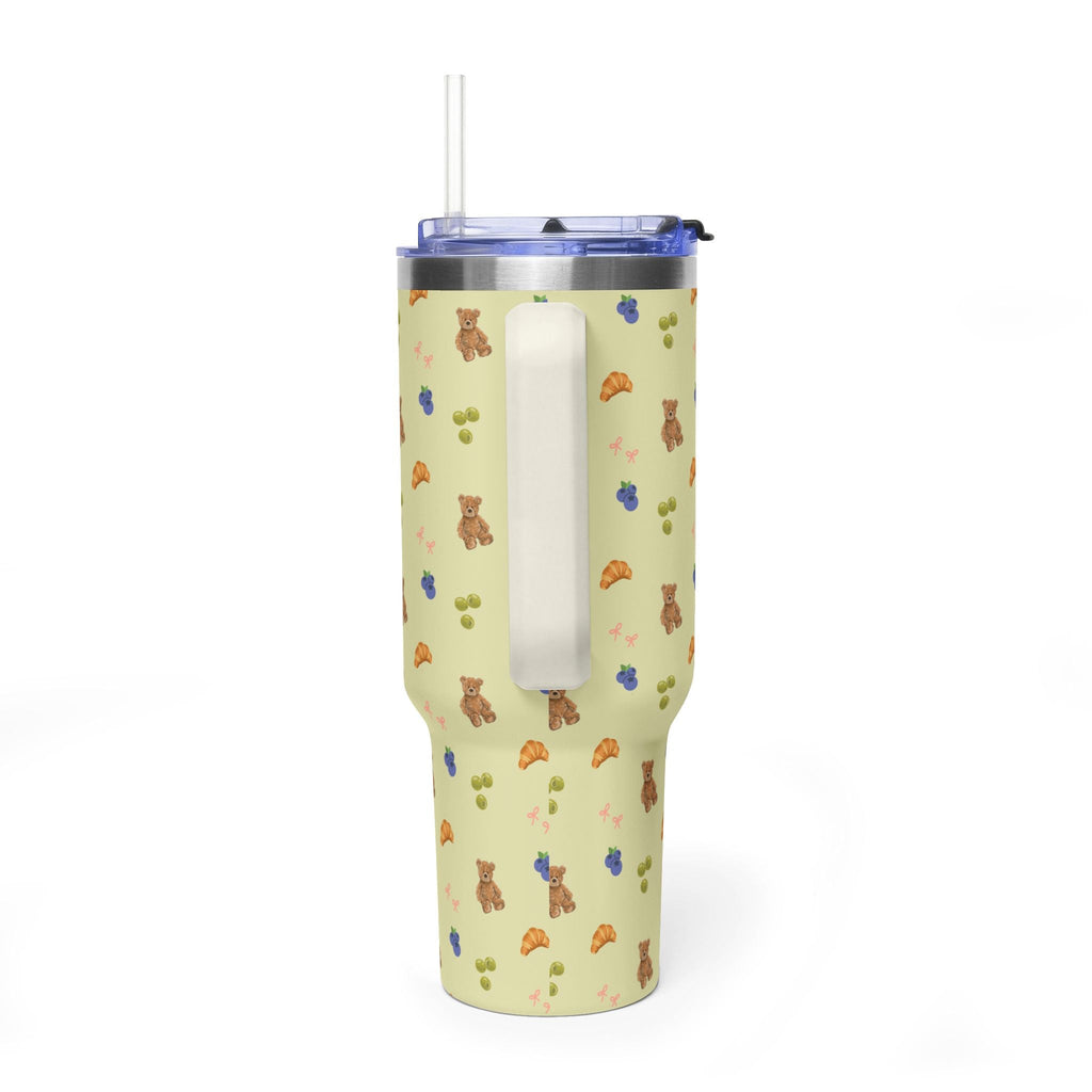 40 oz tumbler side view, metal insert visible, teddy/croissant pattern, blue lid
