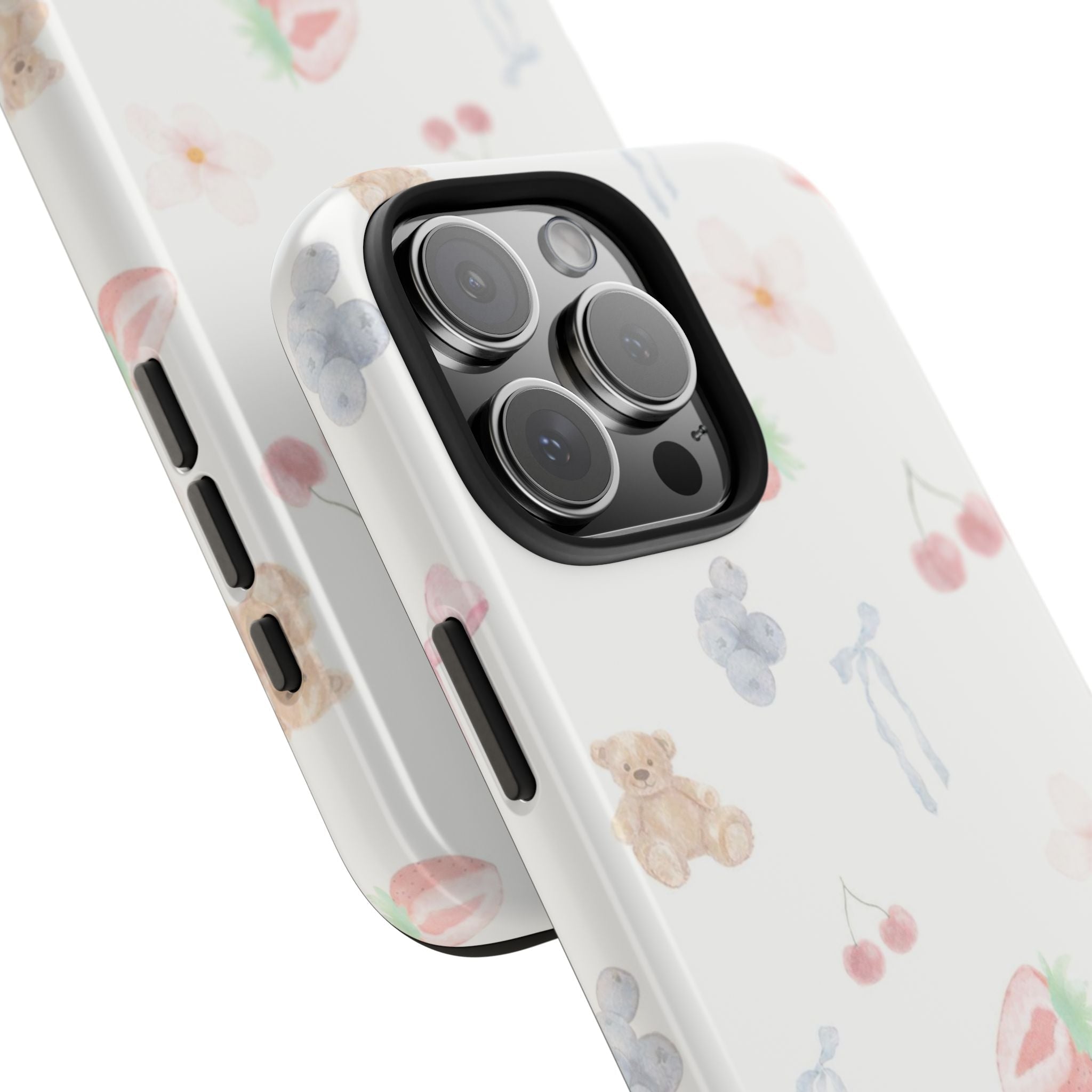 Corner close-up of Sweetheart Bear Club phone case with teddy bear and fruit pattern