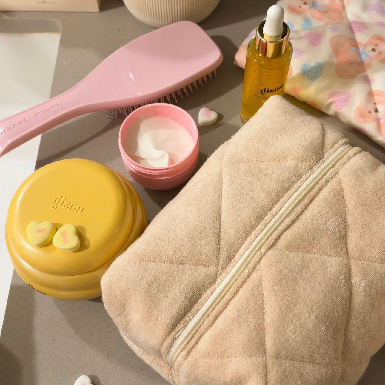Beige teddy fleece cosmetic pouch with quilted panels and long zipper