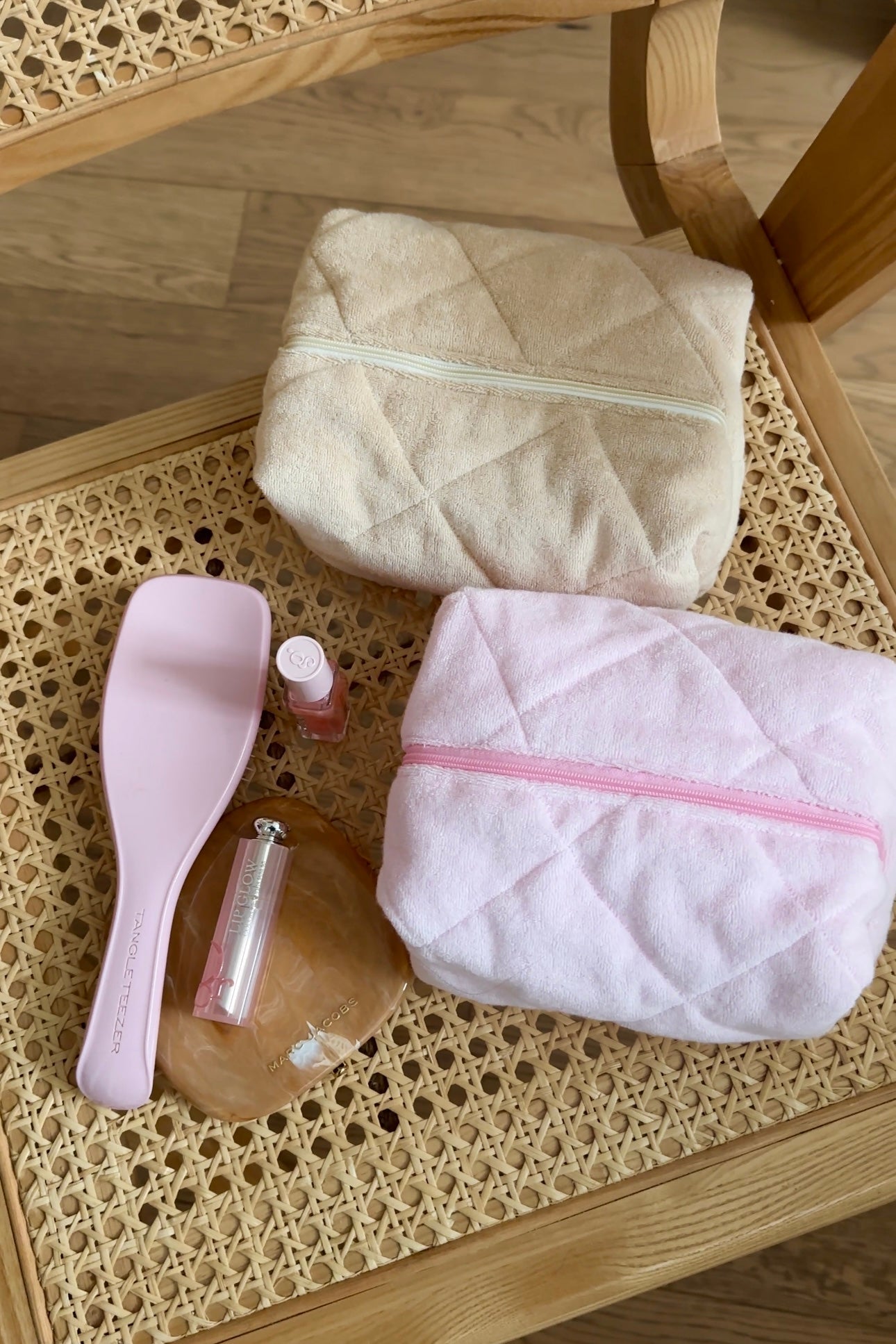 Beige teddy fleece pouch with front panel and pale zipper stripe