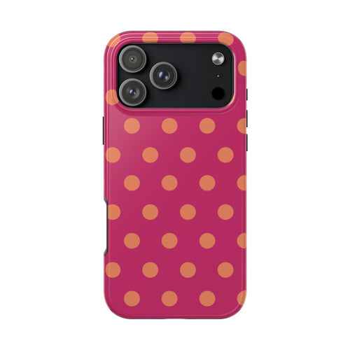 Phone case with orange polka dots on magenta/pink background