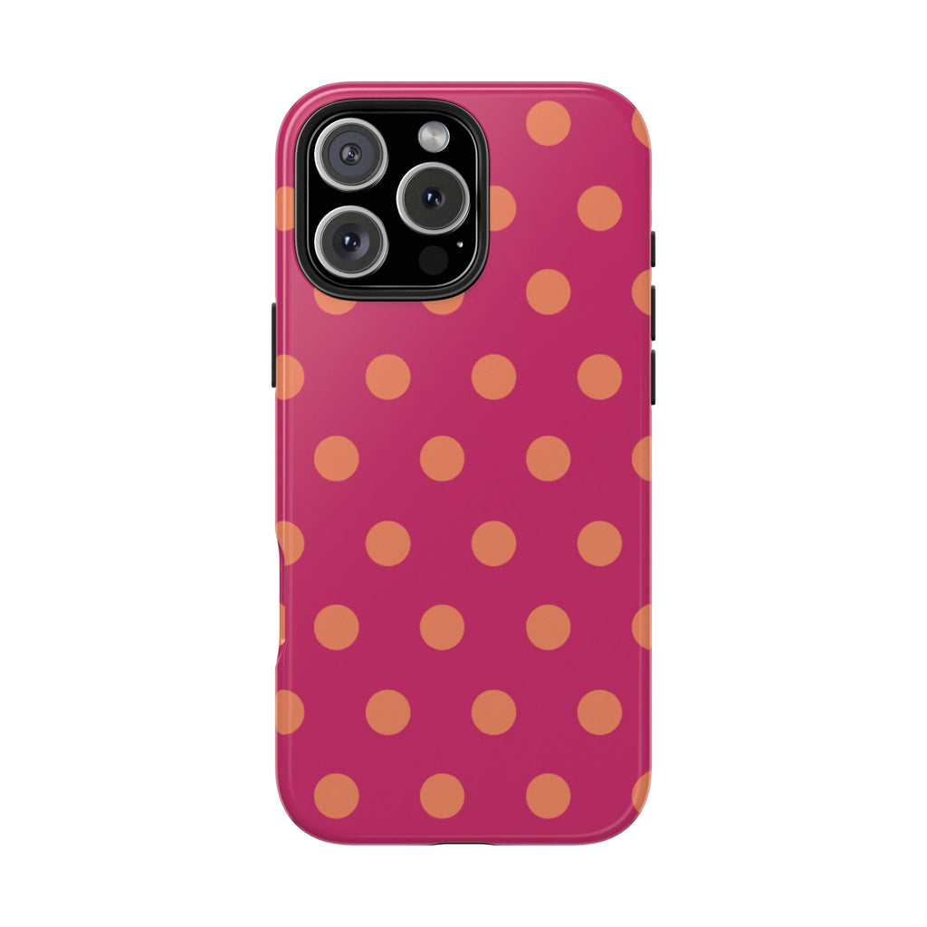 Magenta phone case featuring scattered orange polka dots, raised camera cutouts
