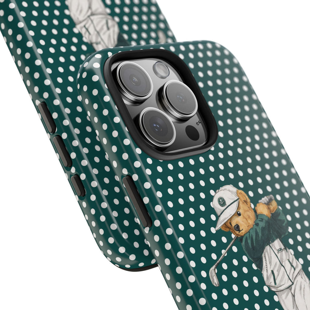 Teal polka-dot phone case angled view; golfer teddy bear graphic and camera cutout