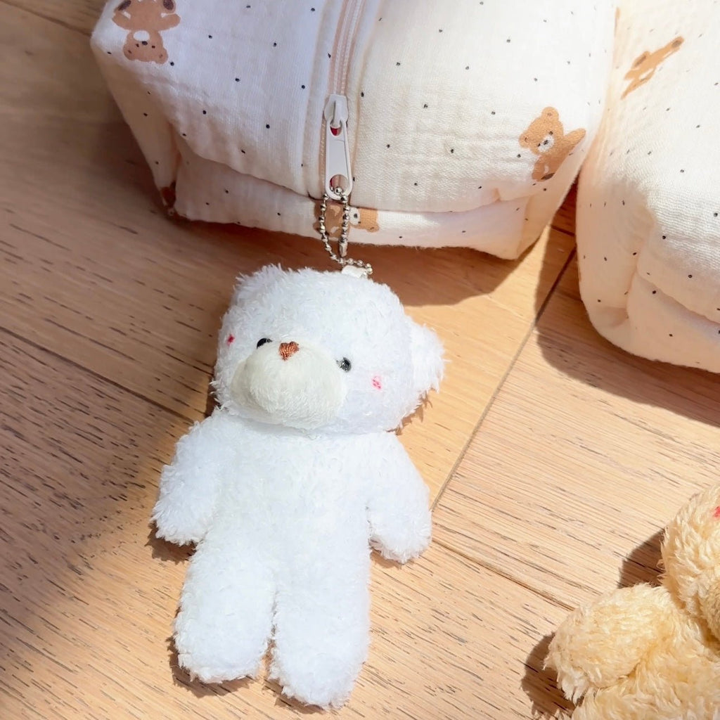 White teddy bear keychain charm with metal clasp, plush animal with button nose