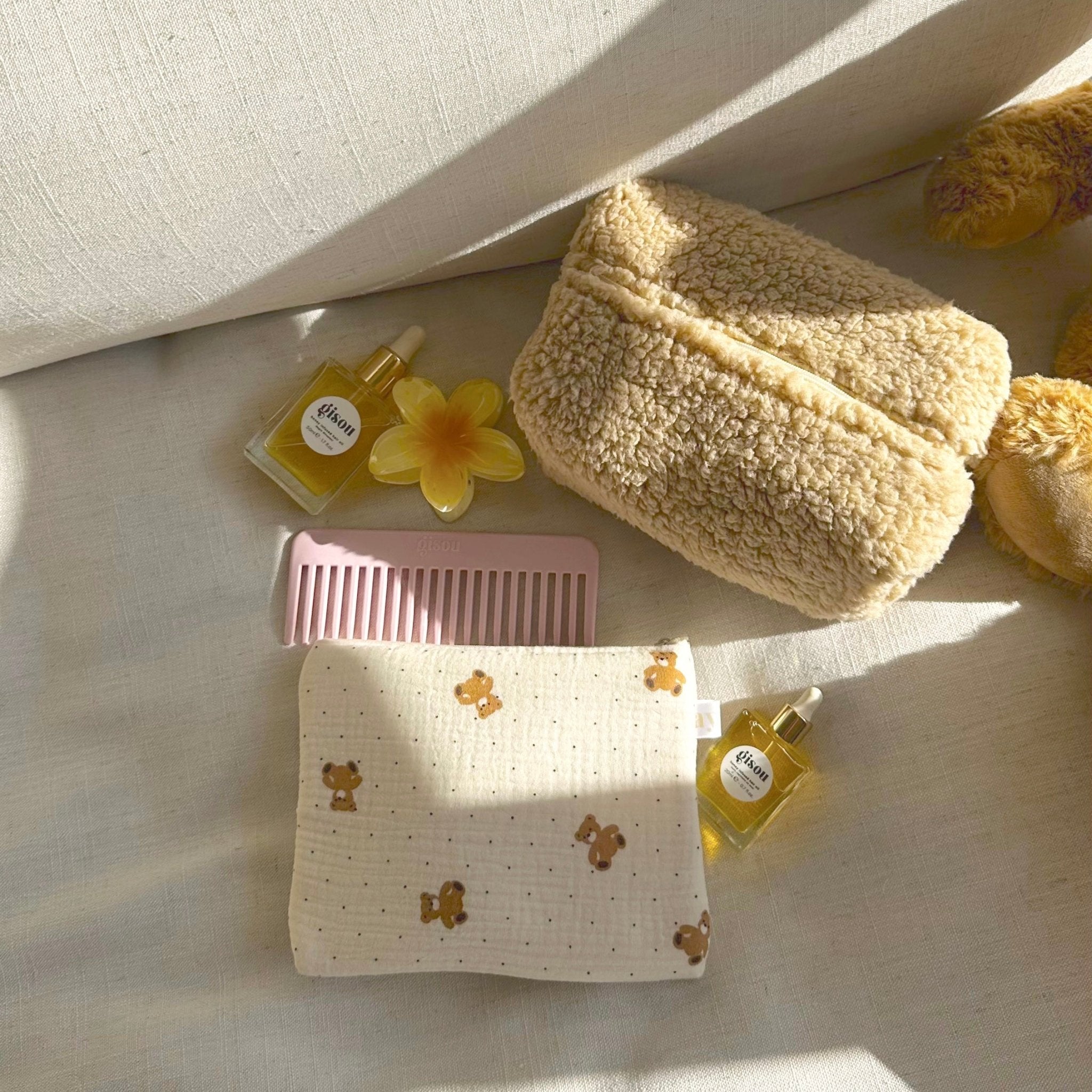 White cream pouch with teddy bears and dots, zipper pouch closed