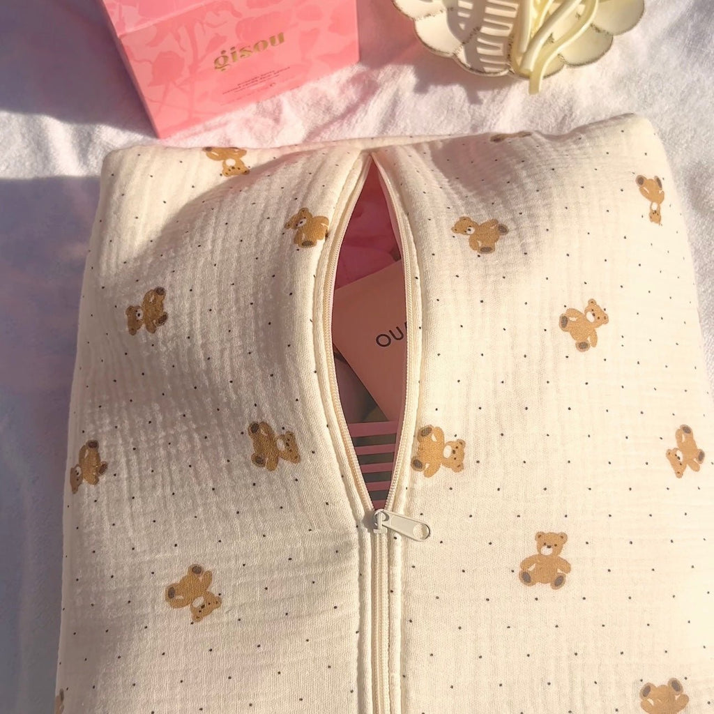 Cream zip pouch with teddy bear polka dot print, open view showing pink interior